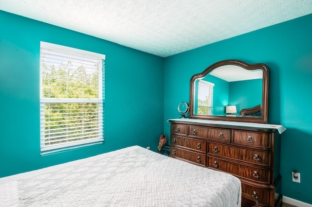 1420 Bellow Falls Pl, Columbus, OH 43228 - bedroom with a textured ceiling and baseboards