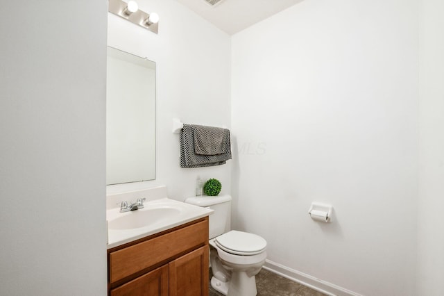 1420 Bellow Falls Pl, Columbus, OH 43228 - half bath featuring vanity, toilet, tile patterned floors, and baseboards
