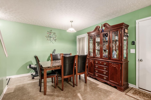 1420 Bellow Falls Pl, Columbus, OH 43228 - dining room featuring a textured ceiling and baseboards
