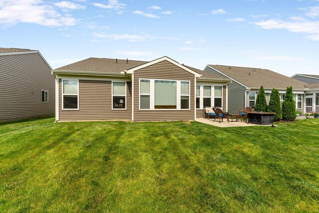 3736 Sanctuary, Hilliard, OH 43026 - rear view of property featuring a patio, a lawn, and a shingled roof