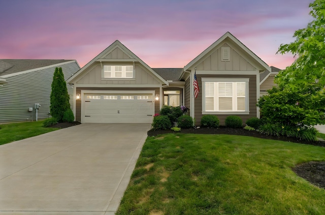 3736 Sanctuary, Hilliard, OH 43026 - view of front of property with board and batten siding, a front yard, driveway, and an attached garage