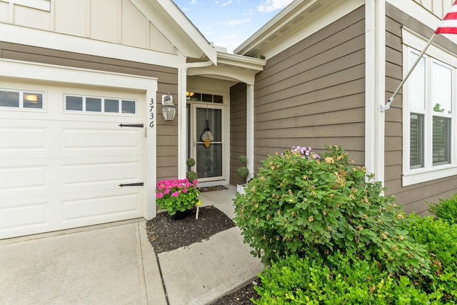 3736 Sanctuary, Hilliard, OH 43026 - property entrance with board and batten siding and an attached garage