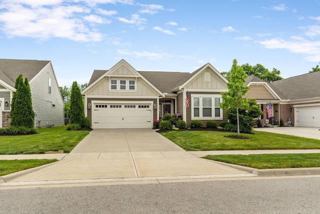 3736 Sanctuary, Hilliard, OH 43026 - craftsman inspired home featuring board and batten siding, a front lawn, concrete driveway, and a garage