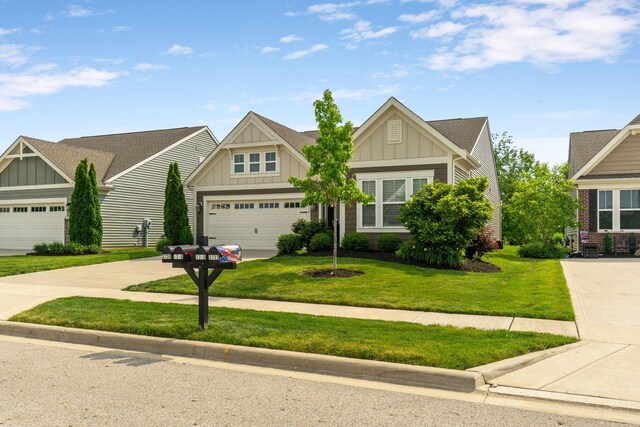 3736 Sanctuary, Hilliard, OH 43026 - craftsman house with board and batten siding, concrete driveway, a garage, a front yard, and roof with shingles