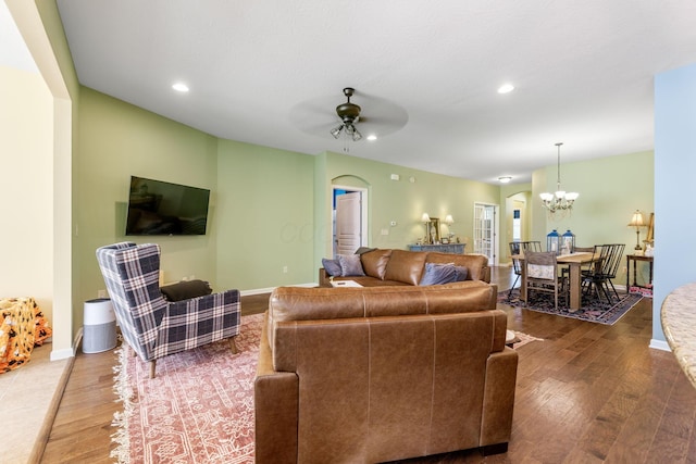 3736 Sanctuary, Hilliard, OH 43026 - living room featuring wood finished floors, a ceiling fan, a chandelier, arched walkways, and recessed lighting