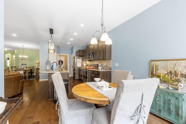 3736 Sanctuary, Hilliard, OH 43026 - dining room with a chandelier, dark wood-type flooring, and recessed lighting