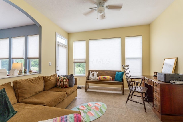 3736 Sanctuary, Hilliard, OH 43026 - living room with arched walkways, ceiling fan, and light tile patterned floors