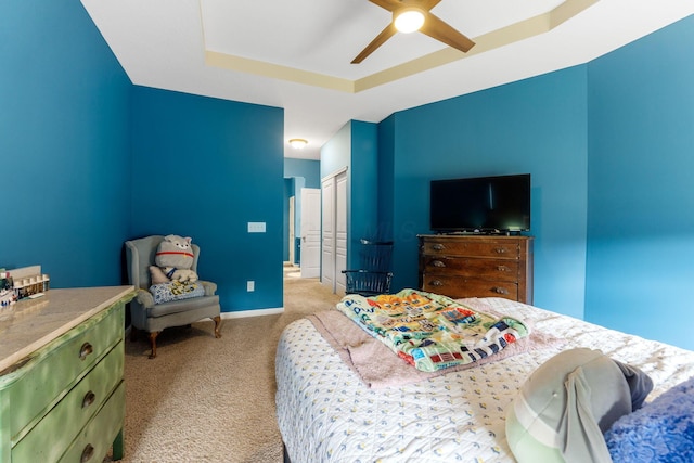 3736 Sanctuary, Hilliard, OH 43026 - bedroom featuring light carpet, a tray ceiling, a closet, and ceiling fan