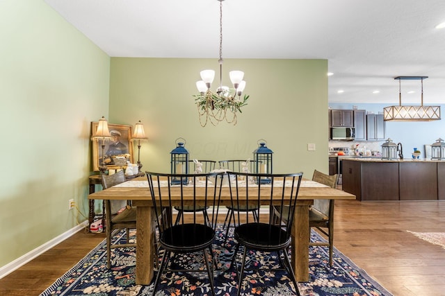 3736 Sanctuary, Hilliard, OH 43026 - dining area with a chandelier, dark wood-style floors, and recessed lighting