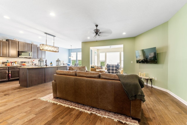 3736 Sanctuary, Hilliard, OH 43026 - living area featuring recessed lighting, a ceiling fan, and light wood-style flooring