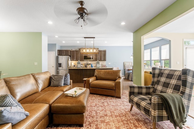 3736 Sanctuary, Hilliard, OH 43026 - living room featuring ceiling fan, recessed lighting, and arched walkways