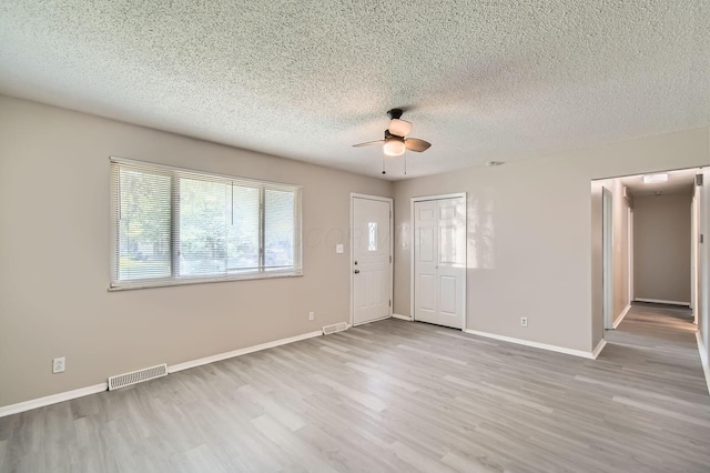 5359 Ivywood Ln, Columbus, OH 43229 - entryway featuring a ceiling fan, wood finished floors, and a textured ceiling