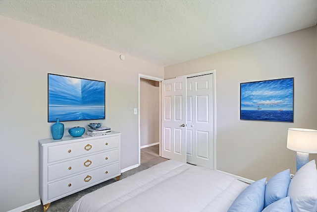 5359 Ivywood Ln, Columbus, OH 43229 - carpeted bedroom with a closet and a textured ceiling