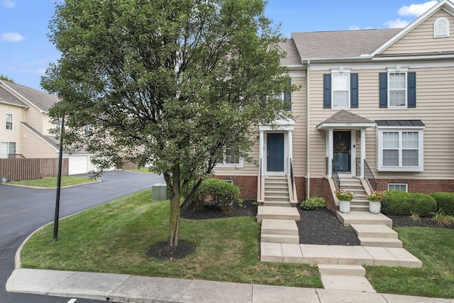 6310 Wagtail Rd Unit 6, Columbus, OH 43230 - view of property with roof with shingles and entry steps