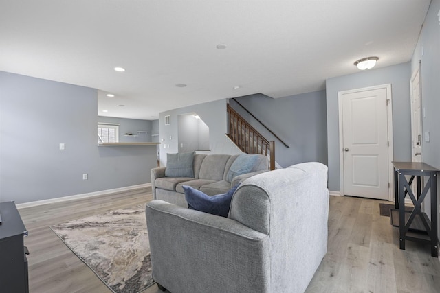 6310 Wagtail Rd Unit 6, Columbus, OH 43230 - living room featuring stairway, light wood-style flooring, baseboards, and recessed lighting