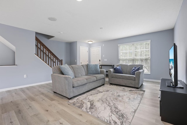 6310 Wagtail Rd Unit 6, Columbus, OH 43230 - living room with light wood finished floors, stairway, and baseboards