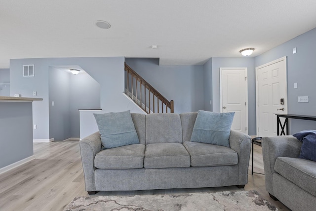 6310 Wagtail Rd Unit 6, Columbus, OH 43230 - living area with wood finished floors, stairs, and baseboards