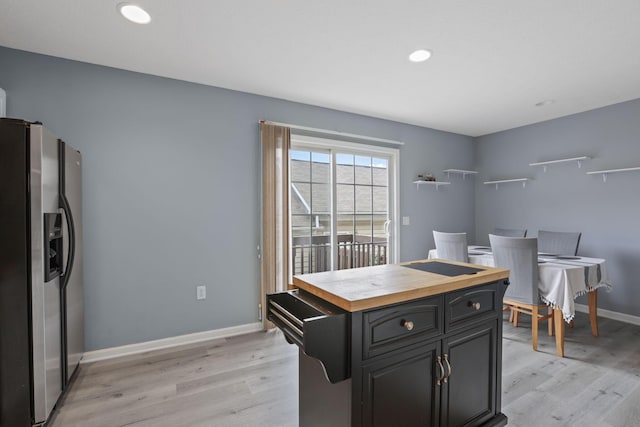 6310 Wagtail Rd Unit 6, Columbus, OH 43230 - kitchen featuring stainless steel refrigerator with ice dispenser, wooden counters, light wood-type flooring, baseboards, and recessed lighting