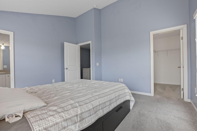 6310 Wagtail Rd Unit 6, Columbus, OH 43230 - carpeted bedroom with a walk in closet, baseboards, and a closet
