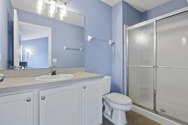 6310 Wagtail Rd Unit 6, Columbus, OH 43230 - full bathroom featuring toilet, a shower stall, tile patterned flooring, and vanity