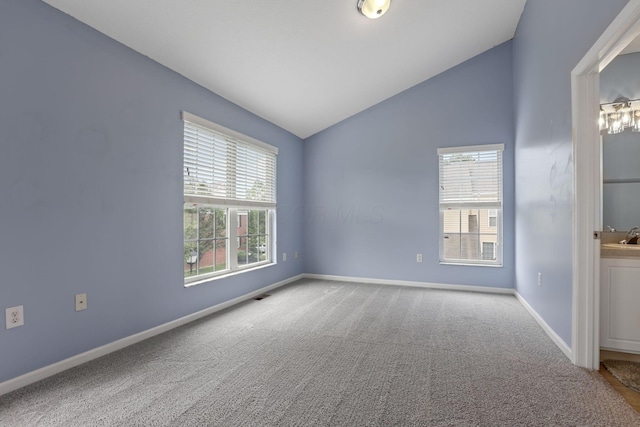 6310 Wagtail Rd Unit 6, Columbus, OH 43230 - carpeted empty room featuring vaulted ceiling and baseboards