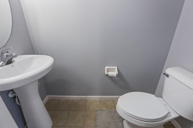 6310 Wagtail Rd Unit 6, Columbus, OH 43230 - half bathroom with tile patterned flooring, toilet, baseboards, and a sink