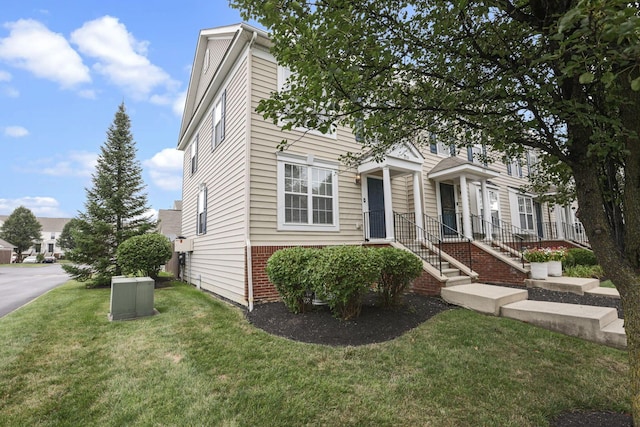 6310 Wagtail Rd Unit 6, Columbus, OH 43230 - view of front of home with a front yard and brick siding