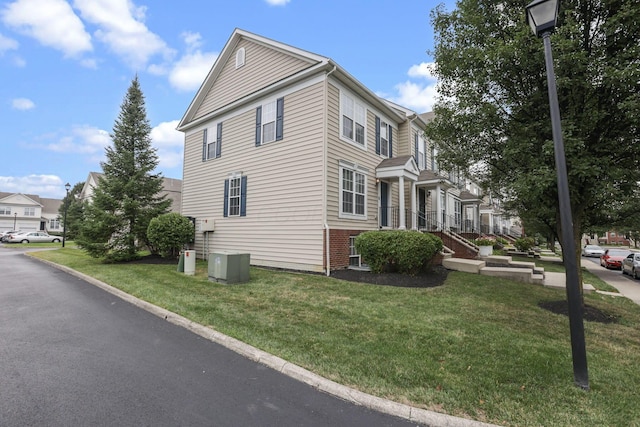 6310 Wagtail Rd Unit 6, Columbus, OH 43230 - view of side of home with a lawn and cooling unit