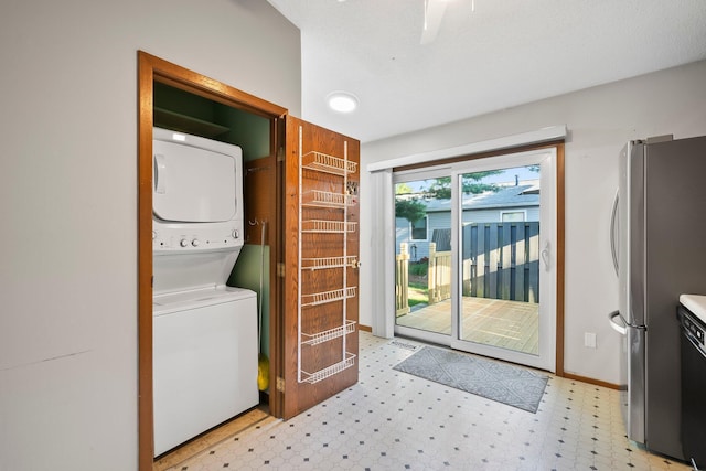 797 Timber Way Dr Unit 16C, Columbus, OH 43085 - washroom with estacked washer and dryer, light floors, and baseboards