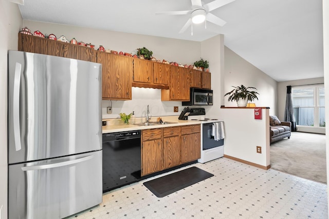 797 Timber Way Dr Unit 16C, Columbus, OH 43085 - kitchen with appliances with stainless steel finishes, light countertops, a sink, lofted ceiling, and baseboards