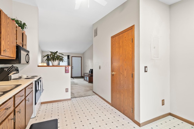 797 Timber Way Dr Unit 16C, Columbus, OH 43085 - kitchen featuring black microwave, electric range, light countertops, light floors, and baseboards