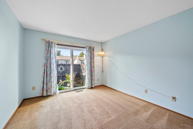 797 Timber Way Dr Unit 16C, Columbus, OH 43085 - spare room with carpet floors, baseboards, and a textured ceiling
