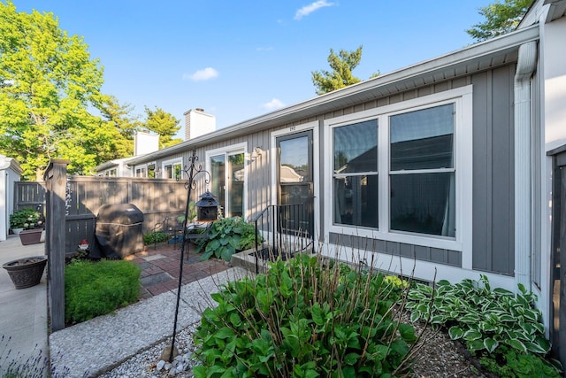 797 Timber Way Dr Unit 16C, Columbus, OH 43085 - view of side of home with a chimney and a patio