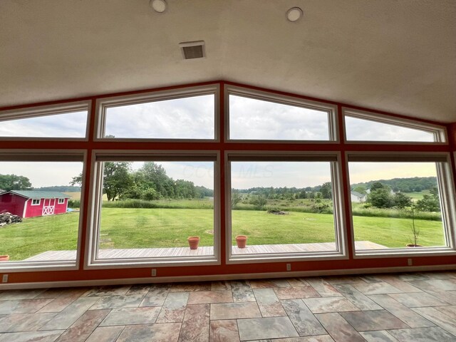20600 Hellwig Rd, Utica, OH 43080 - doorway with vaulted ceiling and stone finish flooring