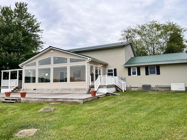 20600 Hellwig Rd, Utica, OH 43080 - back of house with a sunroom, central AC unit, a deck, a lawn, and metal roof