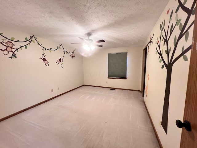 20600 Hellwig Rd, Utica, OH 43080 - unfurnished room featuring ceiling fan, light carpet, a textured ceiling, and baseboards