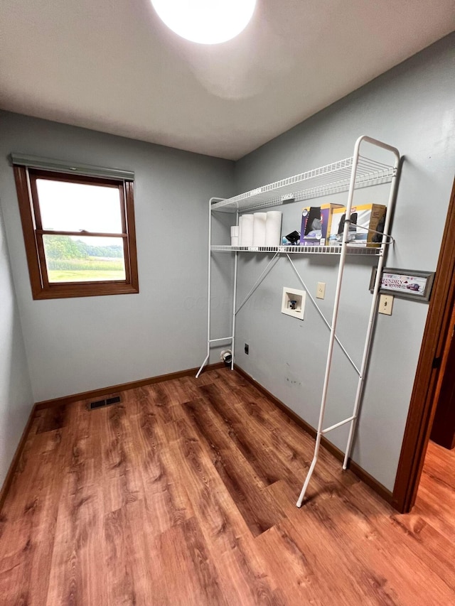 20600 Hellwig Rd, Utica, OH 43080 - laundry room with hookup for a washing machine, wood finished floors, baseboards, and hookup for an electric dryer