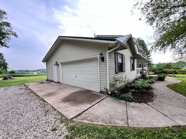 20600 Hellwig Rd, Utica, OH 43080 - view of home's exterior with metal roof and an attached garage
