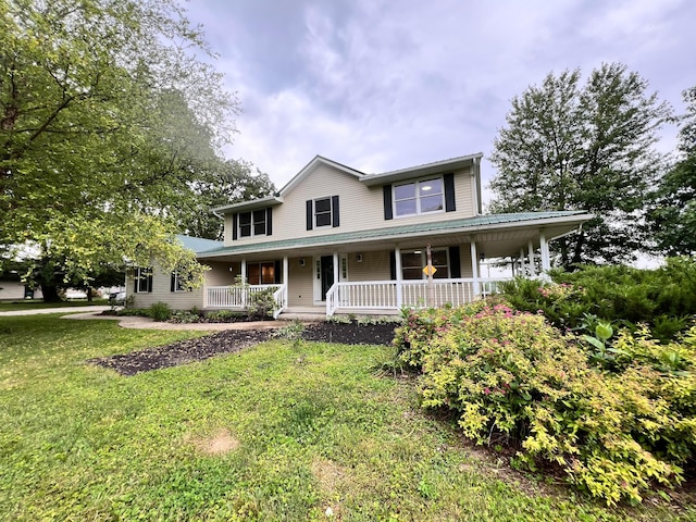 20600 Hellwig Rd, Utica, OH 43080 - farmhouse-style home featuring covered porch and a front lawn