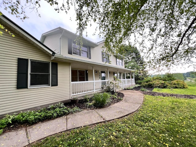 20600 Hellwig Rd, Utica, OH 43080 - view of front of home with a porch and a front lawn