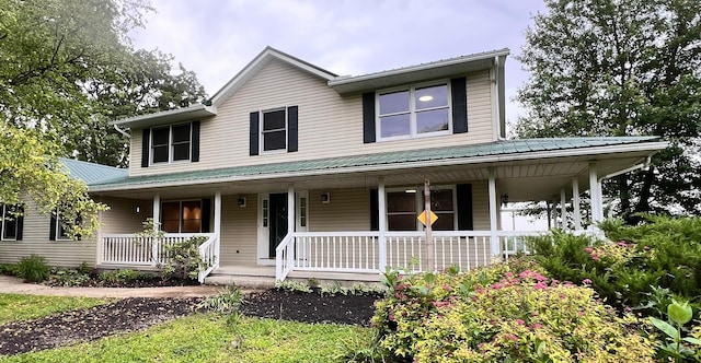 20600 Hellwig Rd, Utica, OH 43080 - country-style home featuring covered porch and metal roof