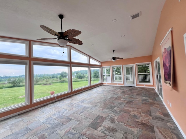 20600 Hellwig Rd, Utica, OH 43080 - unfurnished sunroom featuring baseboards, stone tile floors, and high vaulted ceiling