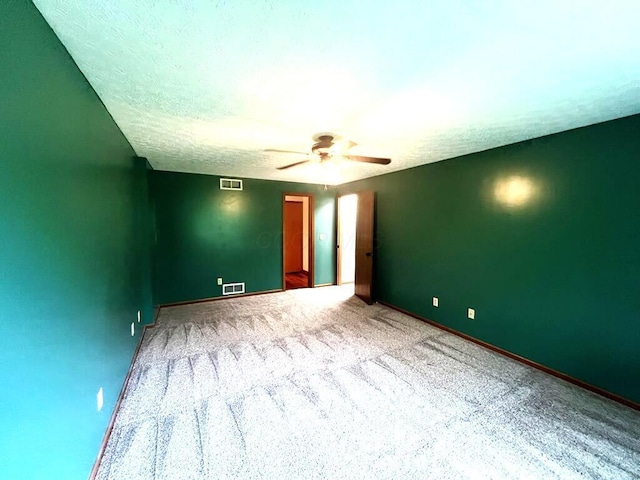 20600 Hellwig Rd, Utica, OH 43080 - carpeted spare room featuring ceiling fan, baseboards, and a textured ceiling