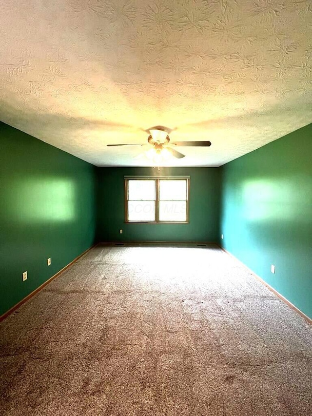 20600 Hellwig Rd, Utica, OH 43080 - empty room featuring carpet flooring, ceiling fan, a textured ceiling, and baseboards