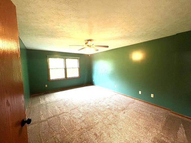 20600 Hellwig Rd, Utica, OH 43080 - carpeted empty room with ceiling fan, a textured ceiling, and baseboards