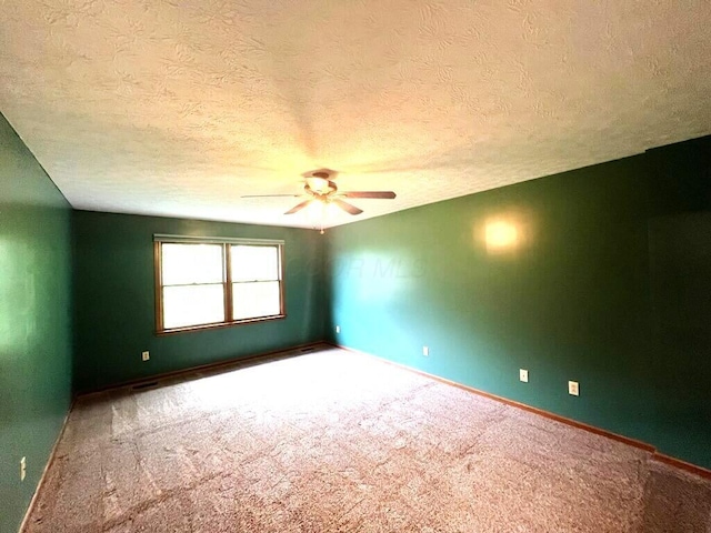 20600 Hellwig Rd, Utica, OH 43080 - empty room featuring ceiling fan, carpet flooring, baseboards, and a textured ceiling