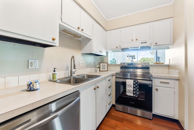 3013 La Vista Dr Unit 29, Columbus, OH 43204 - kitchen with appliances with stainless steel finishes, a sink, under cabinet range hood, ornamental molding, and light countertops