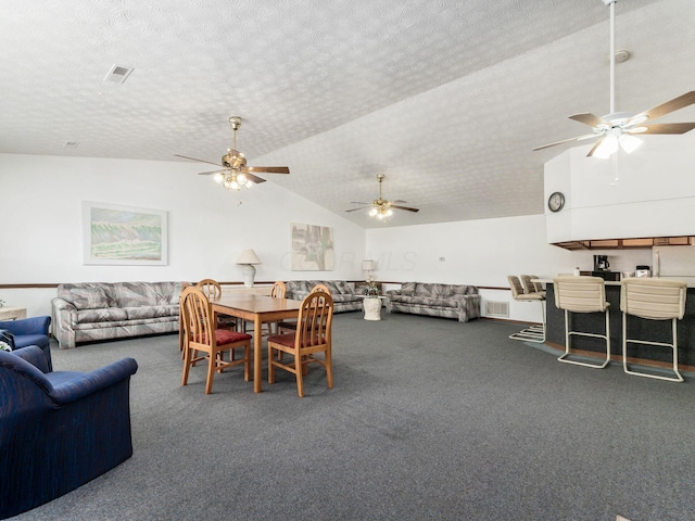 4393 Hammerton Dr Unit 14B, Columbus, OH 43228 - dining room featuring lofted ceiling, carpet floors, a ceiling fan, and a textured ceiling