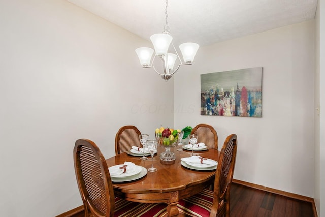 4393 Hammerton Dr Unit 14B, Columbus, OH 43228 - dining room featuring a chandelier and wood finished floors