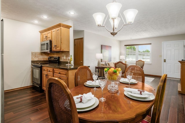 4393 Hammerton Dr Unit 14B, Columbus, OH 43228 - dining room featuring dark wood-type flooring, a chandelier, recessed lighting, and a textured ceiling